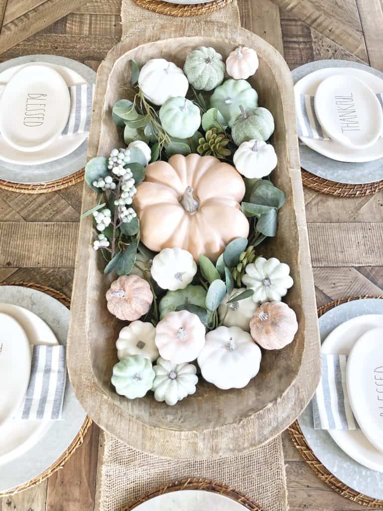 Painted pumpkins in dough bowl