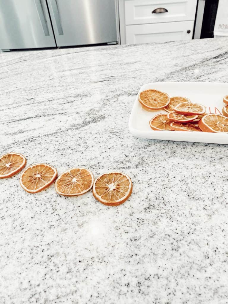 Stringing Dried Orange Slices on a Garland