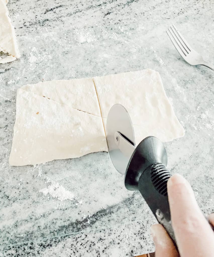 Cutting the dough for meat pie