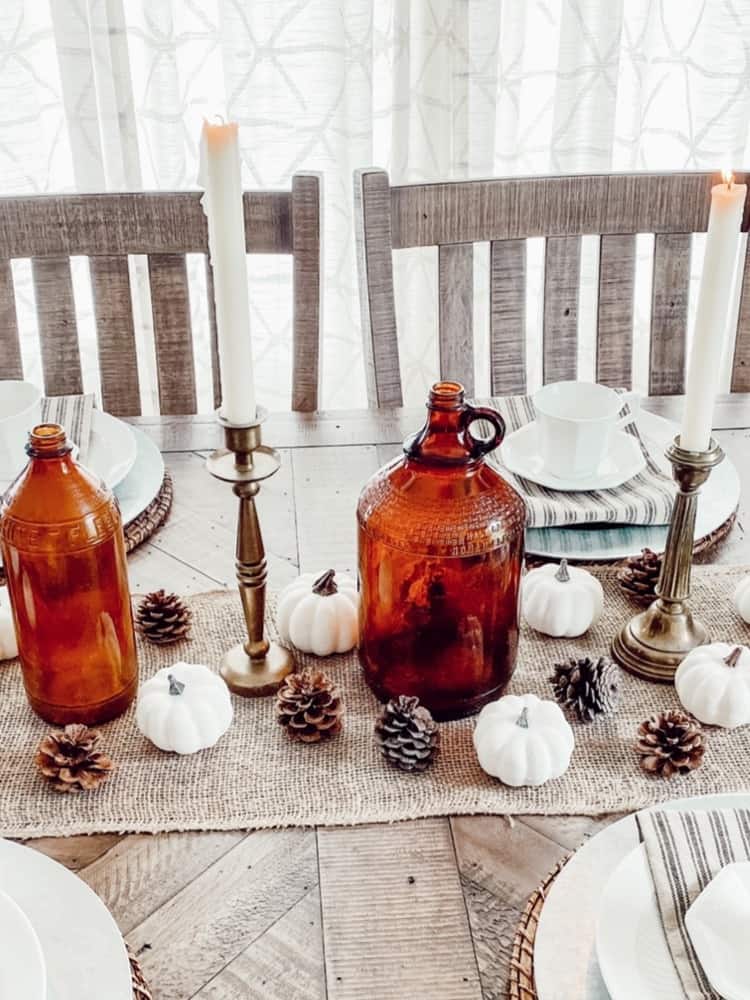 Close Up of Amber Bottles and Candlesticks