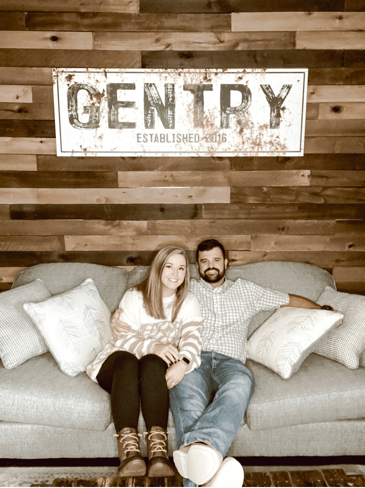 Us in front of our Shiplap Wall