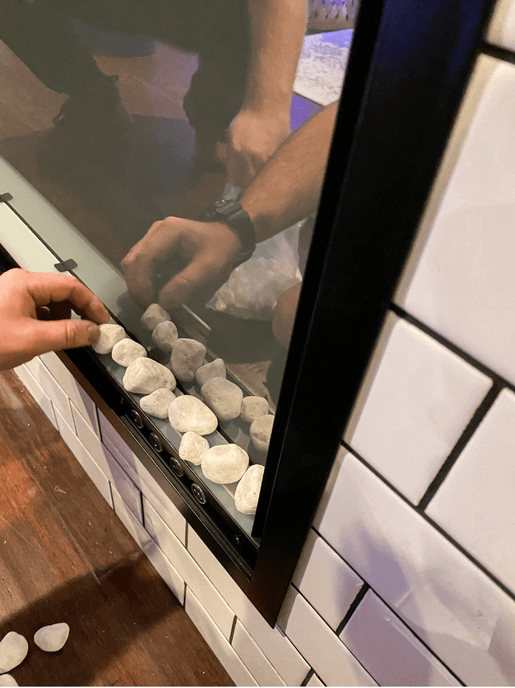 Adding the rocks into the fireplace 