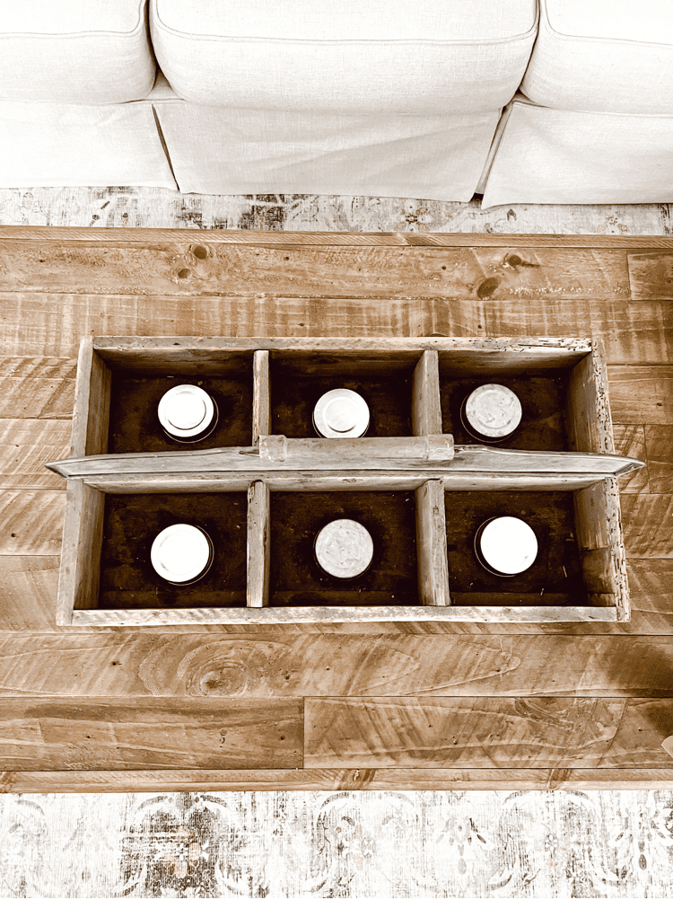 Candle lids in antique tool caddy