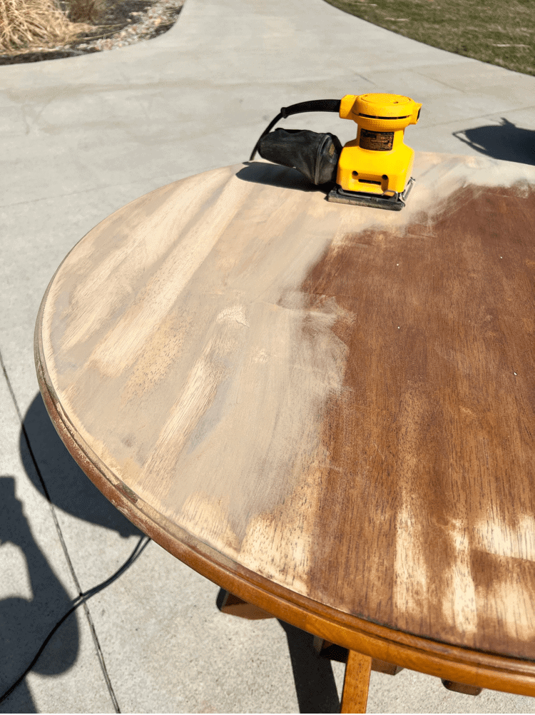 Close up view of sanding down the table