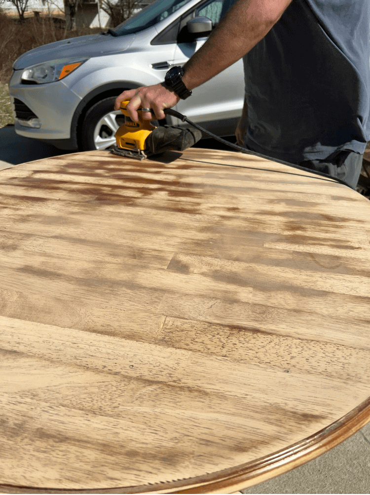 Working on sanding the table down