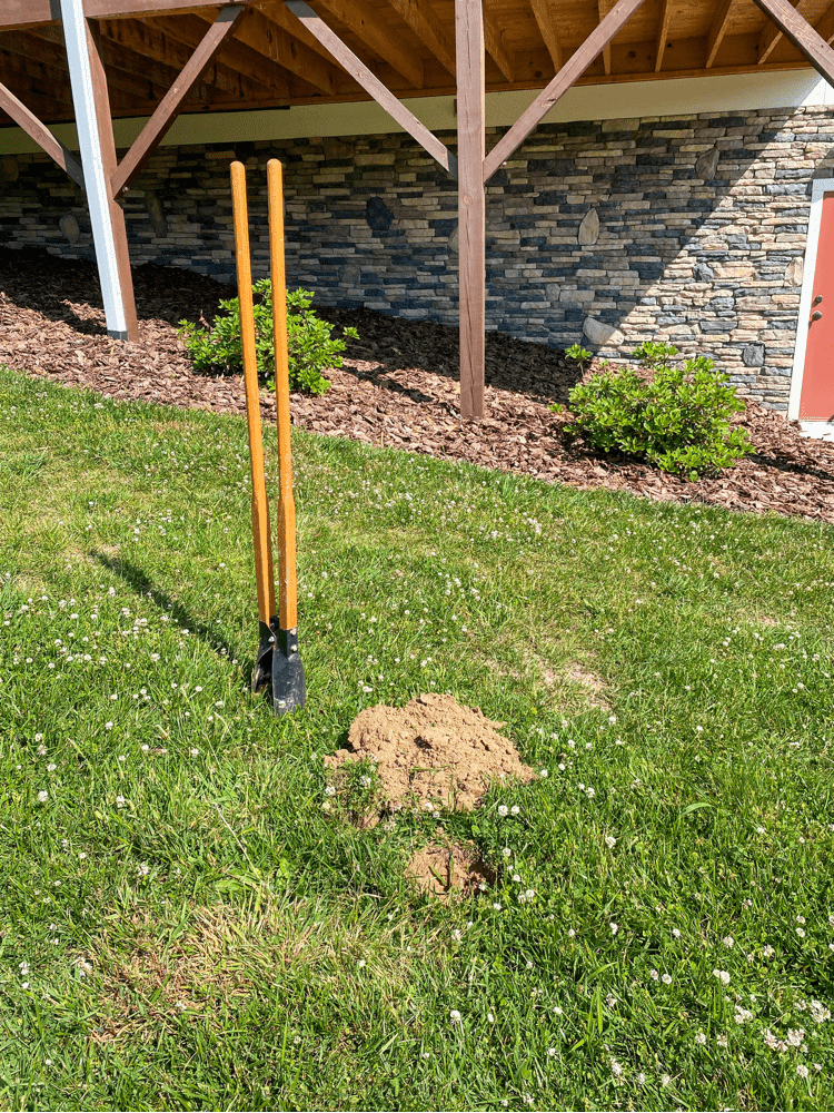 Digging a hole for wooden post