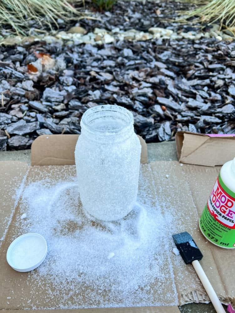 Adding the Fake Snow to Jars
