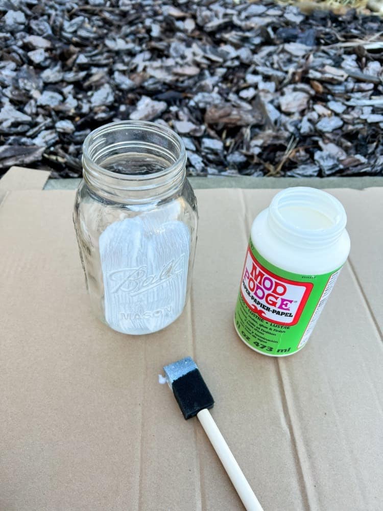 create faux snow-covered mason jar luminaries for the holiday season - DIY  Snowy Mason Jars