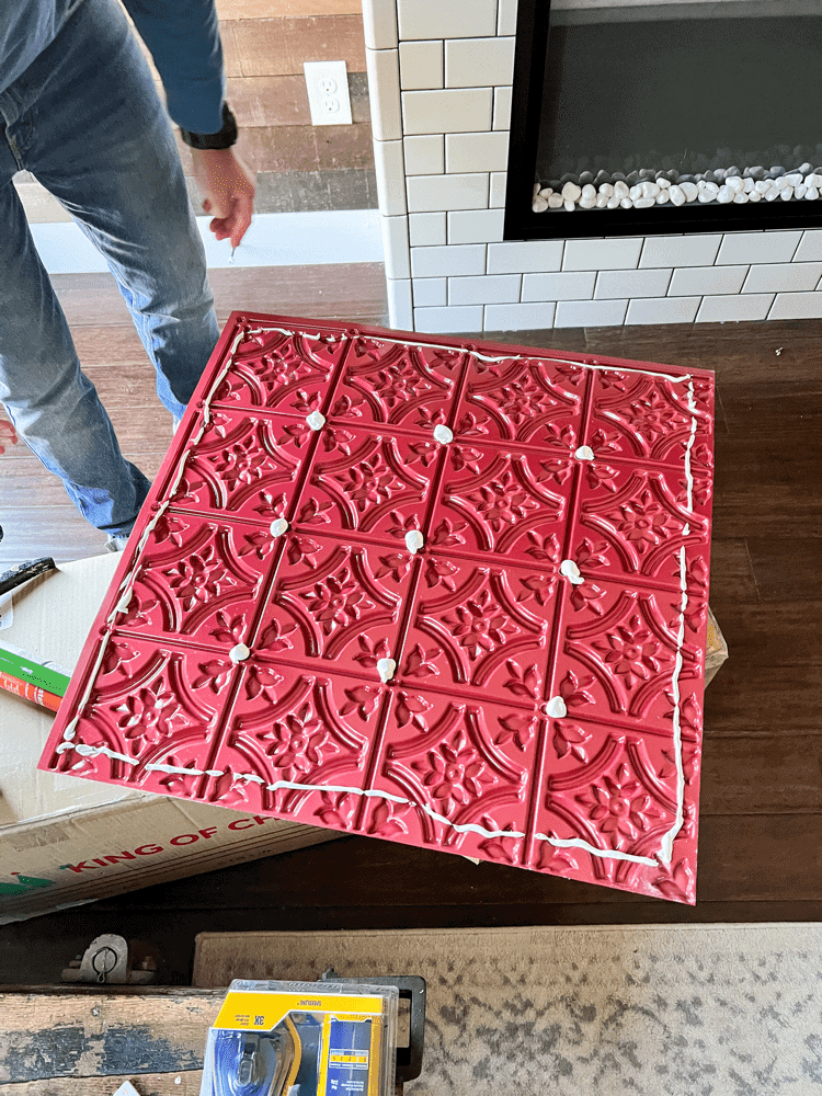 Applying Glue to Ceiling Tiles