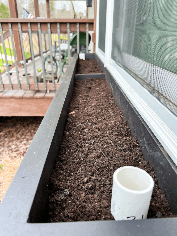 Filling Up Window Box With Potting Soil