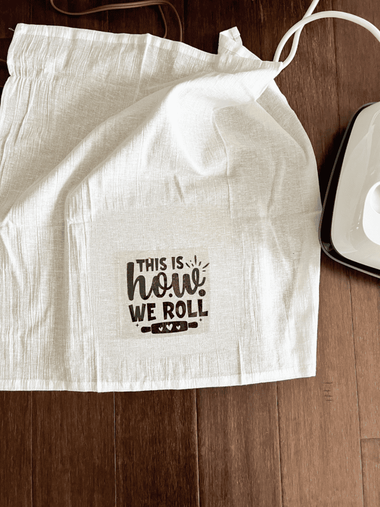 Ironing on Vinyl Design to Kitchen Towel