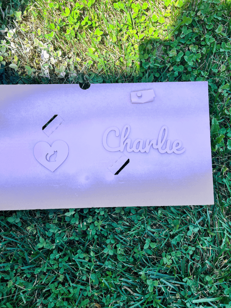 Spray Painting Charlie Sign