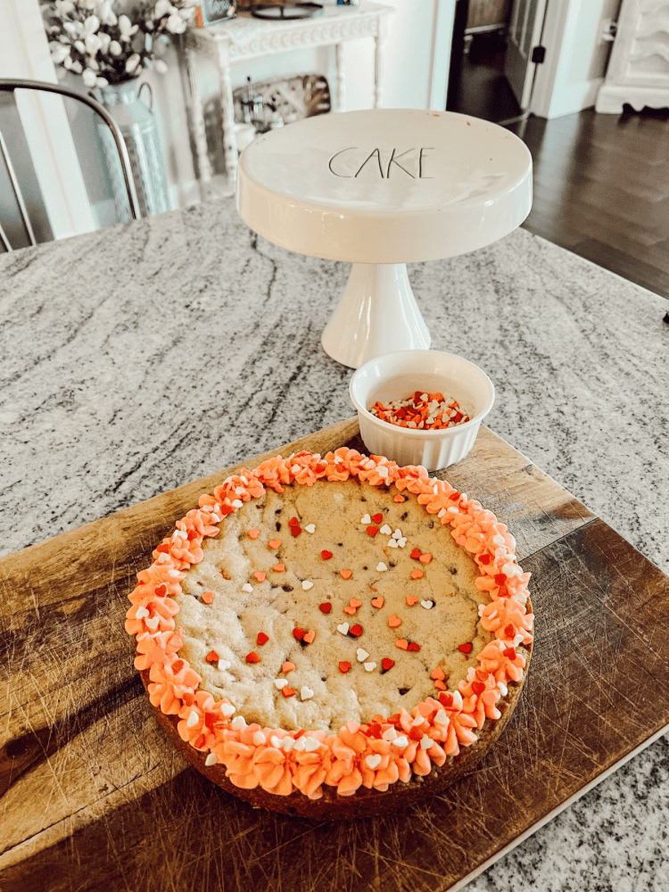 Cutting Valentines Day Cookie Cake